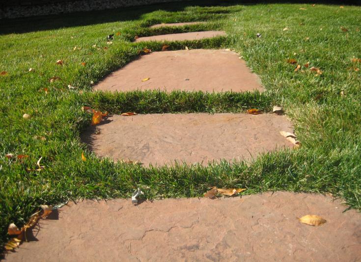 red flagstone steppers in lawn