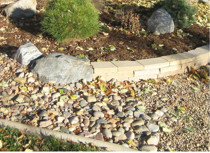 stripstone wall and granite boulder