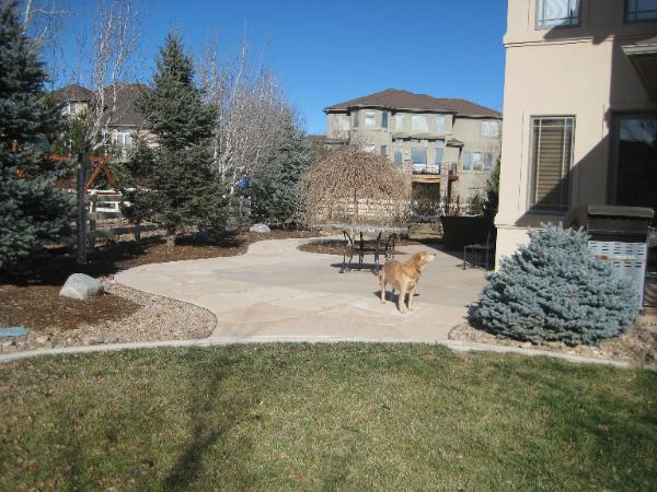 flowing flagstone walkway wraps patio