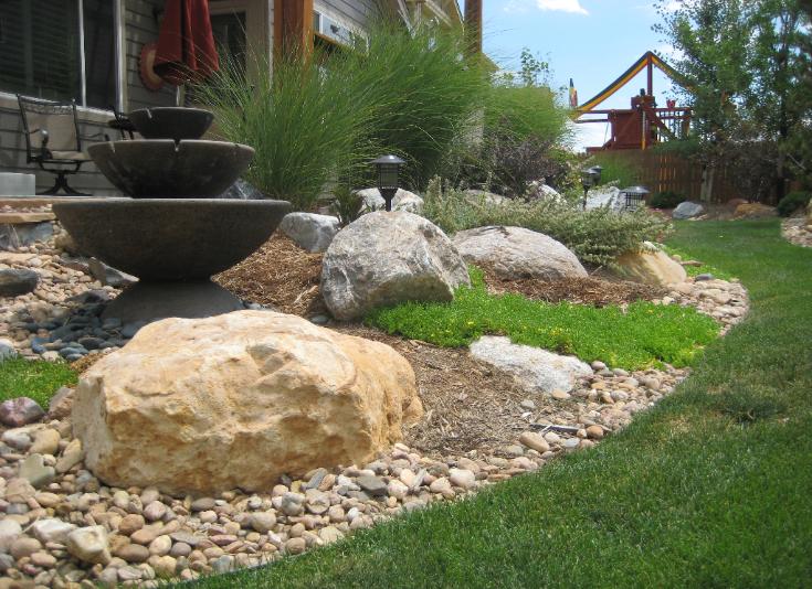 rock garden with upright fountain